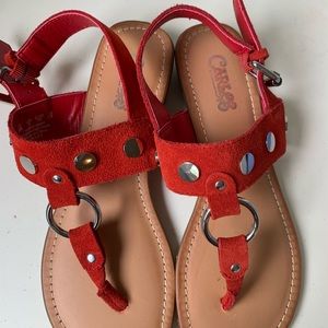 Red sandals with silver accents